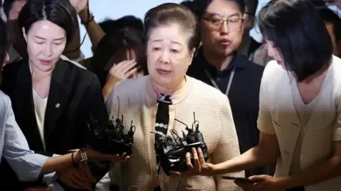 Disputed Religious Leader Rejects Bribery Accusations Against Ex-South Korea President's Wife